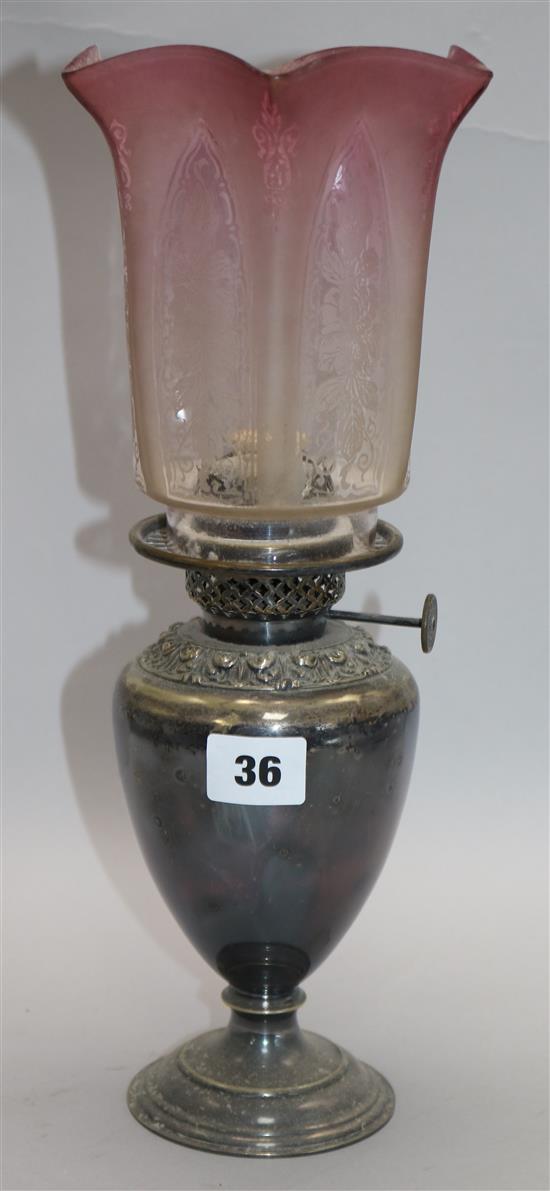 A late Victorian silver plated oil lamp, with tinted glass shade H.35cm.